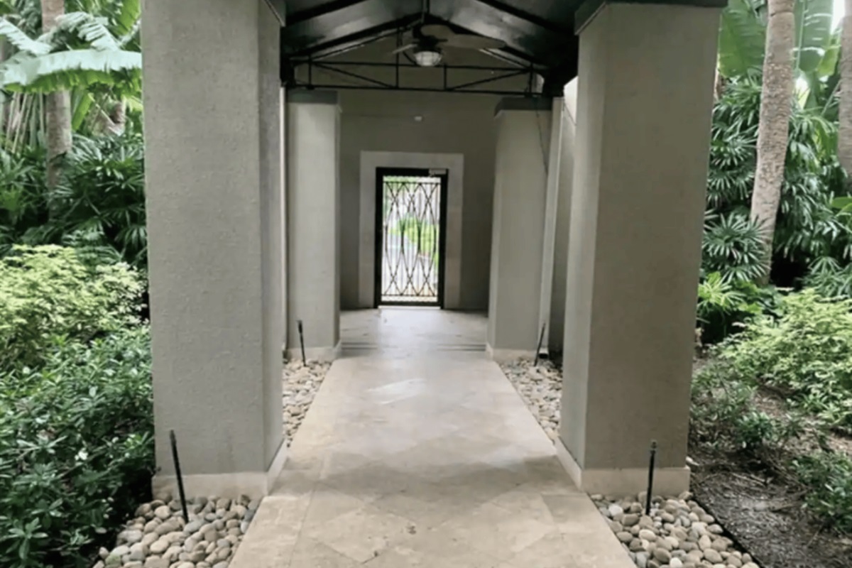 The main hallway inside the community, leading to the elevators behind you.