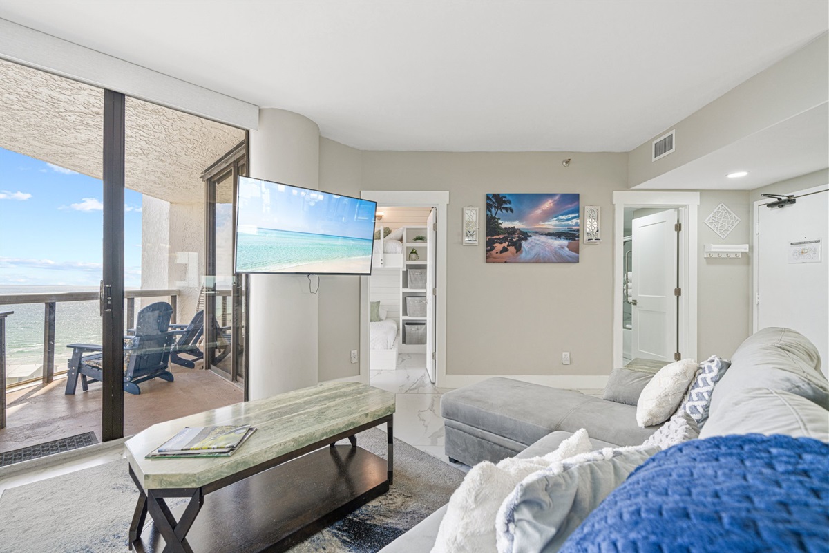 The Gulf fills this living room from floor to ceiling. There is not a single obstruction between the sectional and the horizon.