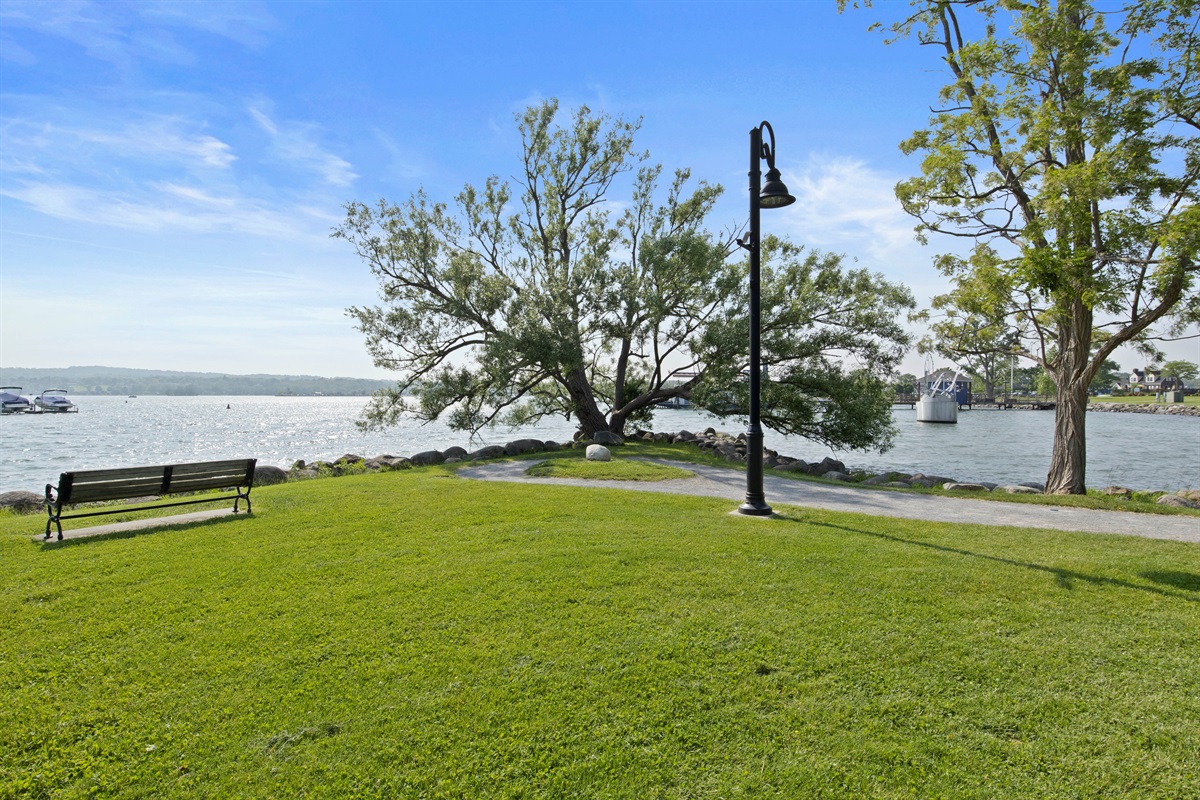 Stroll the waterfront trail and relax under the shade of a stunning lakeside tree