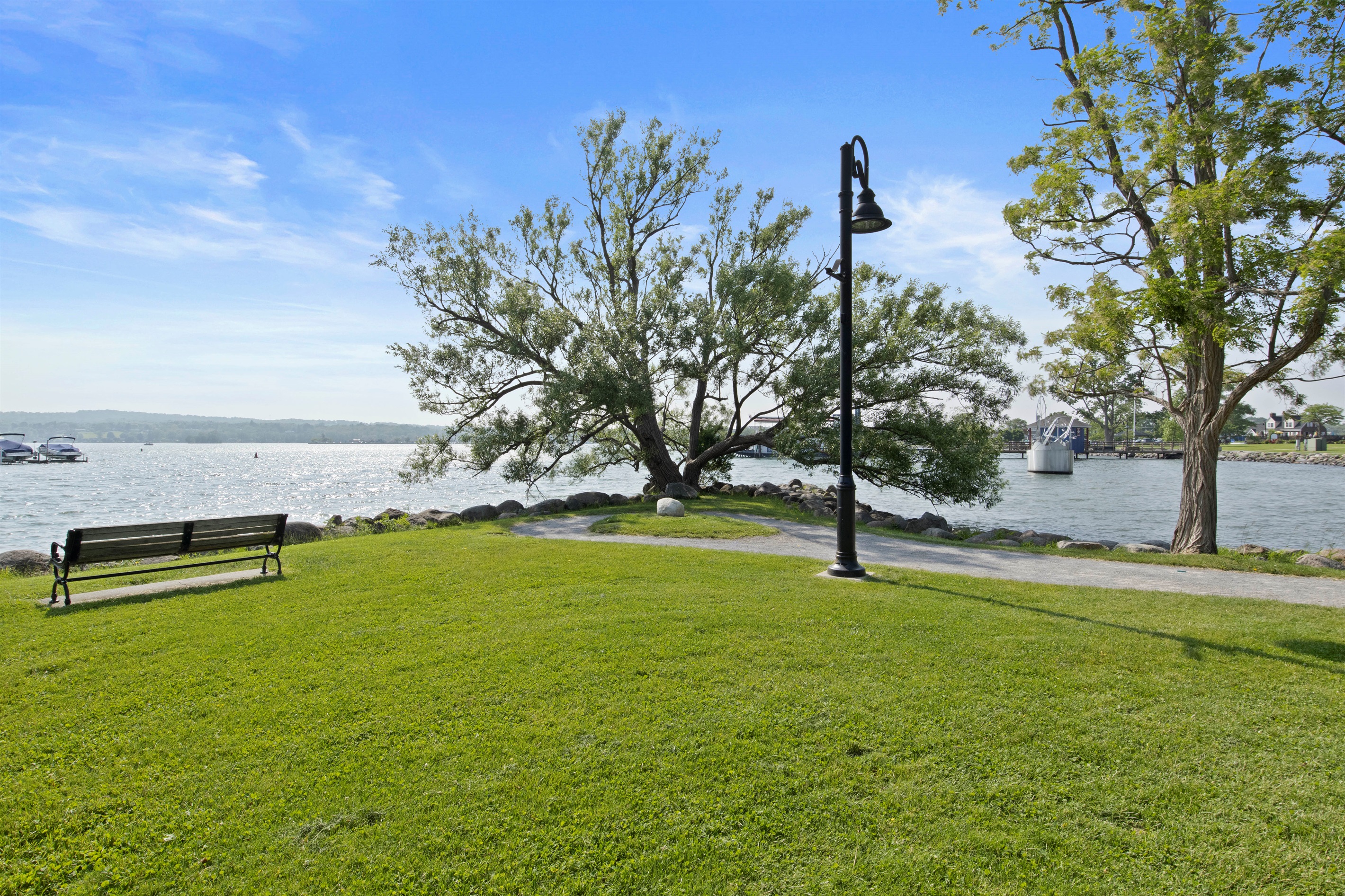 Stroll the waterfront trail and relax under the shade of a stunning lakeside tree
