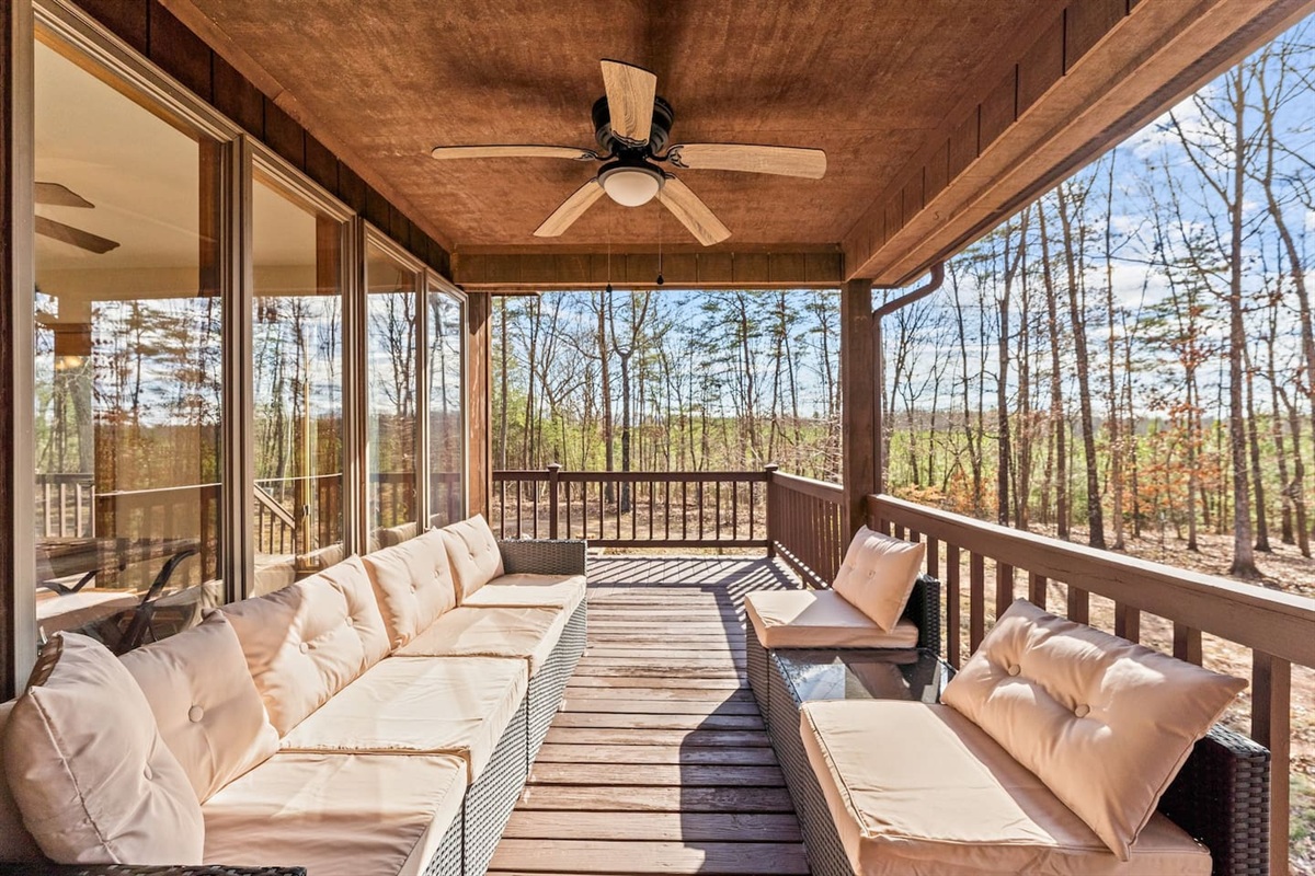 Screened Porch Retreat: Enjoy serene forest views while lounging on plush seating in style!