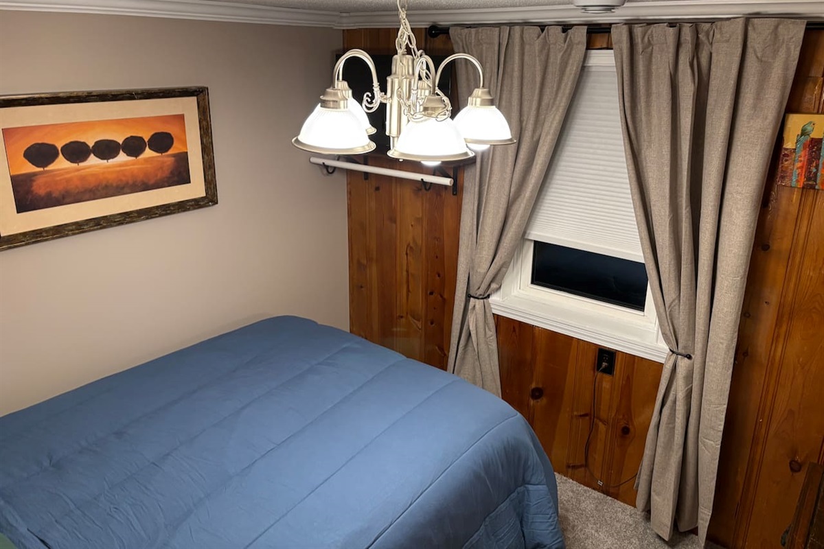 Light filtering shade allows for privacy, without sacrificing light. Close curtains for darkening and temperature comfort. No closet available in this room, but it offers a clothing rod to hang some things if needed. Located below the TV.