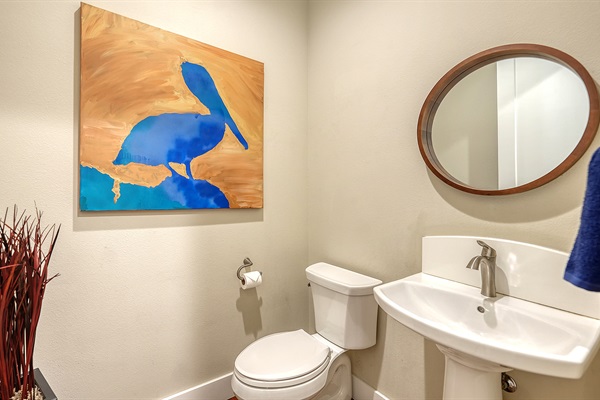 Feel like you are at the beach in the half bathroom off the kitchen/garage
