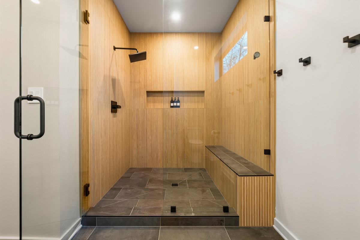 Another view of the shower area shows off the sleek design and warm finishes, giving it that upscale feel you&rsquo;ll definitely appreciate.