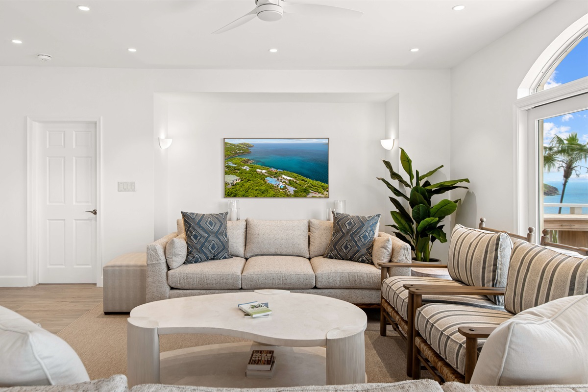 Spacious, ocean-view lounge with vaulted ceilings, Smart TV, board games, and room to unwind. Perfect for lazy mornings or movie nights.