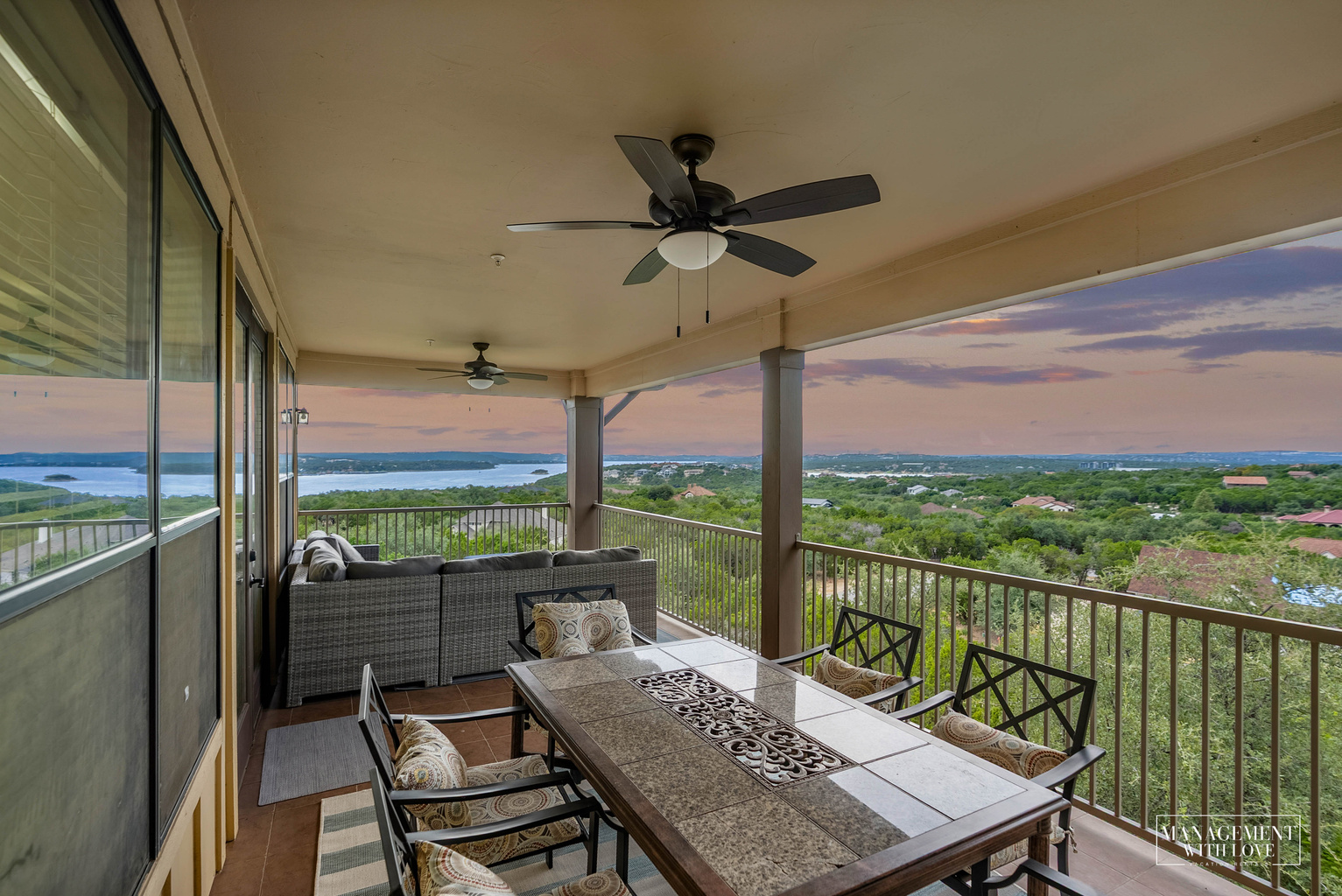 Outdoor TV, dining, and lounge seating make the balcony an extension of the living space.