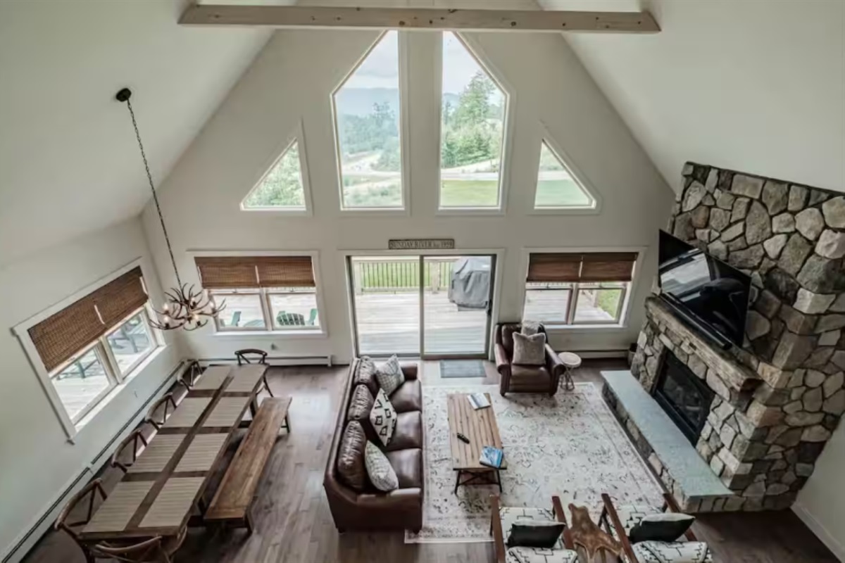 Relax on the open-concept main floor and enjoy mountain views, a fireplace, and a big-screen TV.