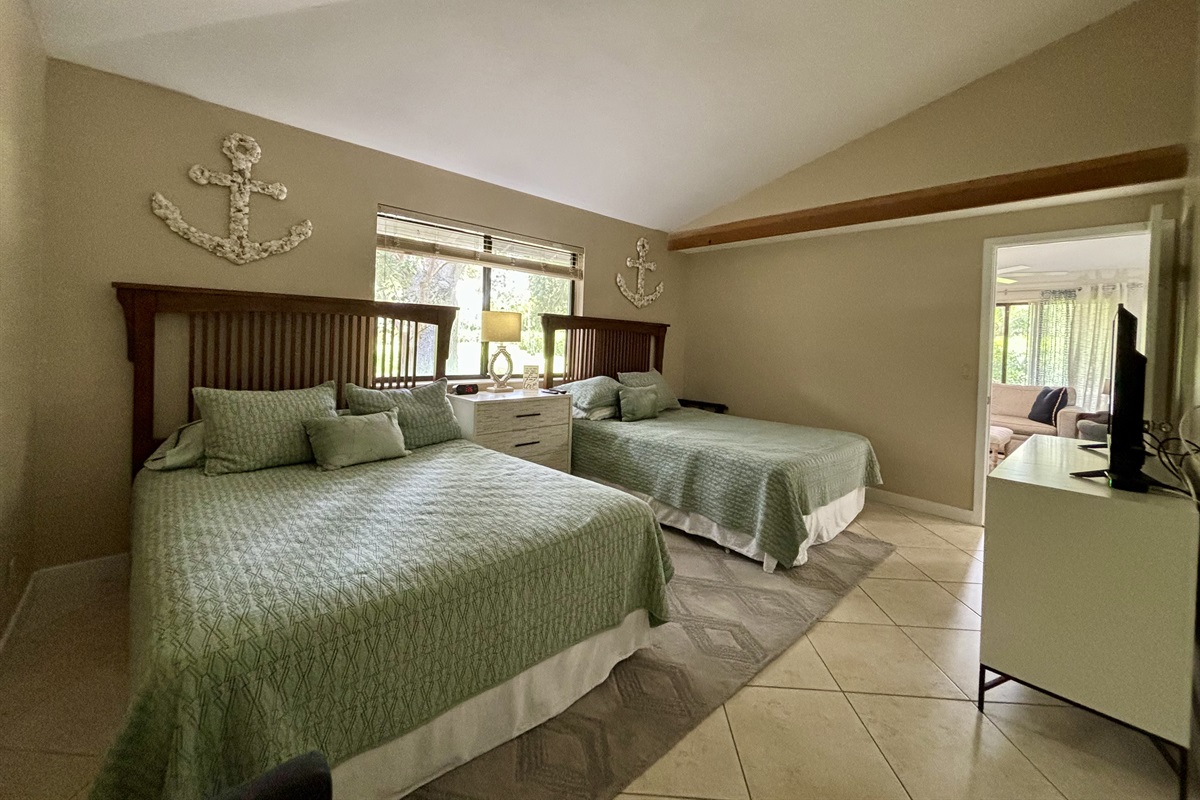 The Master Bedroom features two king beds, a TV, large closet and dresser with plenty of space for storage.