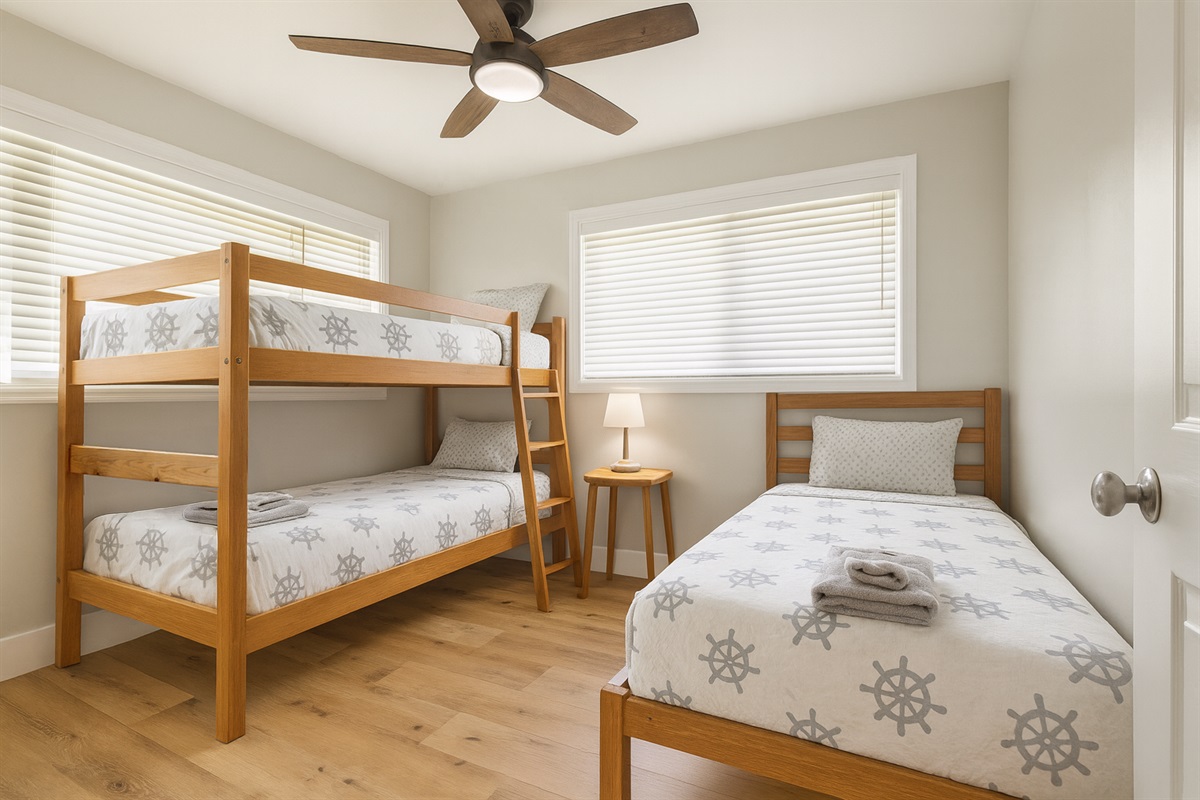 Twin over Twin Bunk + Twin Bed | Representative Interior. Finishes and decor vary by Unit