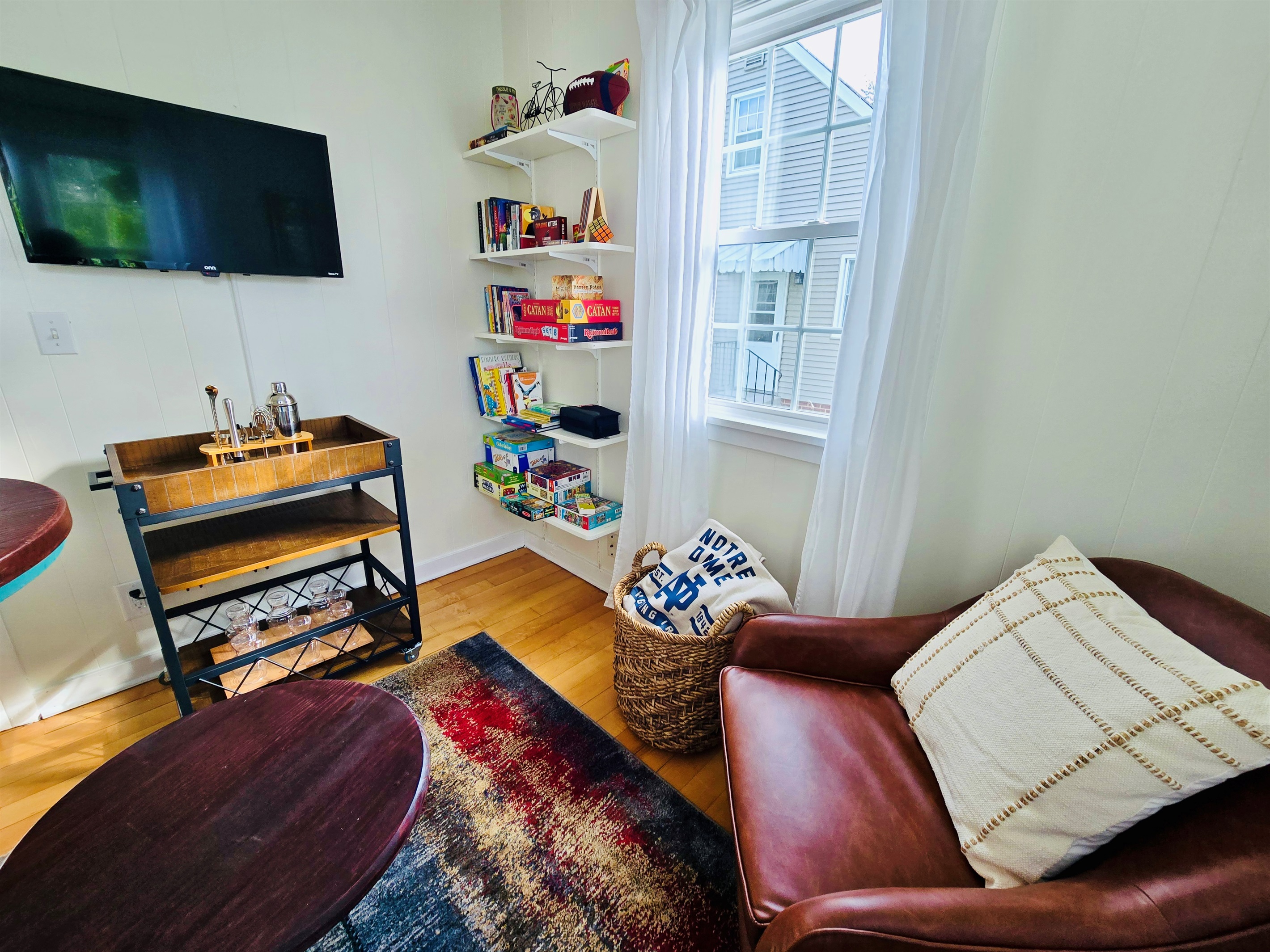 Welcome to the Sunshine Lounge—where the bar cart’s stocked, the TV’s ready, and shelves brim with family games and books for every age. Sink into the comfy chair, wrap up in the ND blanket, and let the good times roll.