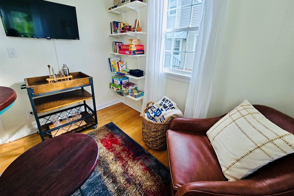 Welcome to the Sunshine Lounge—where the bar cart’s stocked, the TV’s ready, and shelves brim with family games and books for every age. Sink into the comfy chair, wrap up in the ND blanket, and let the good times roll.