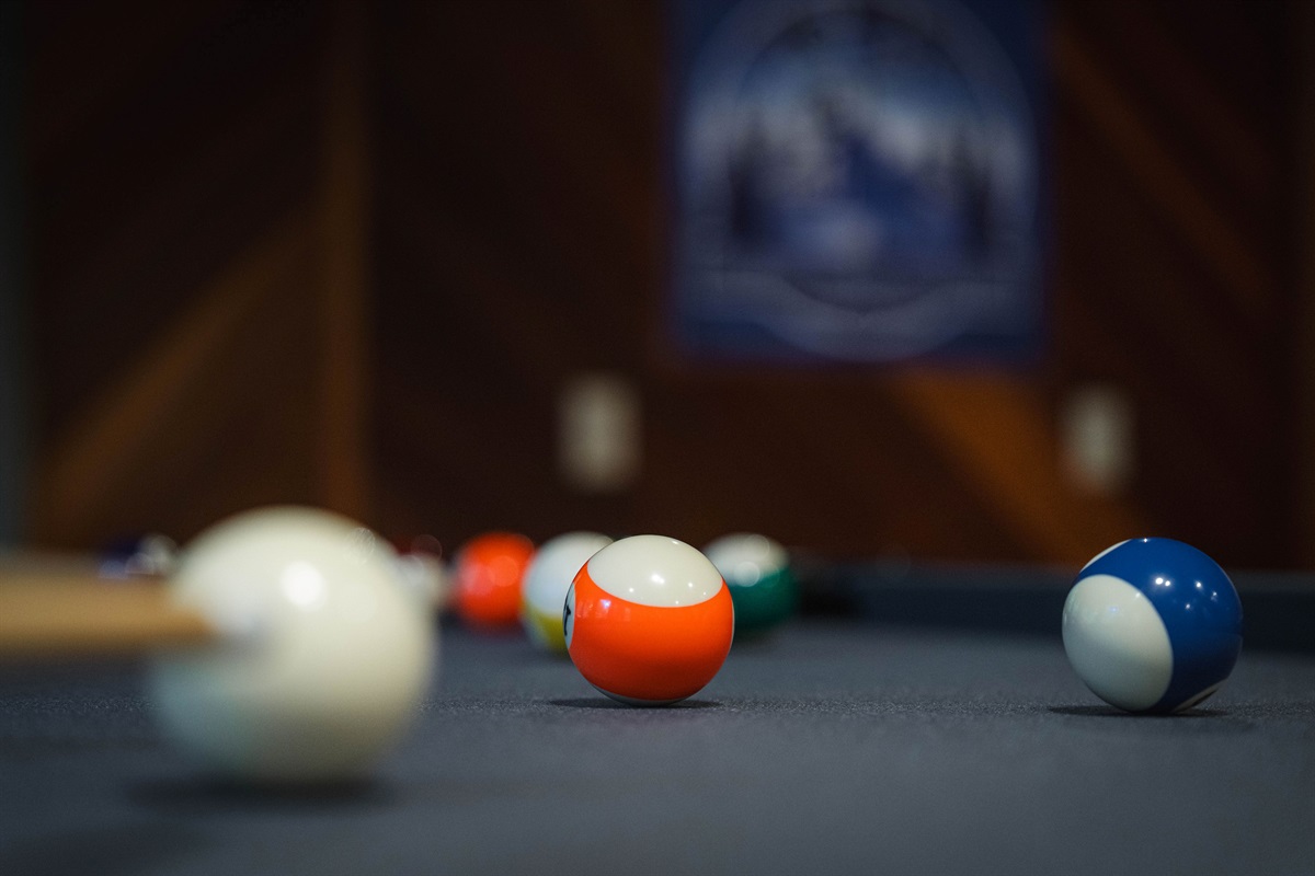 Pool balls ready for action on the game room’s billiards table.