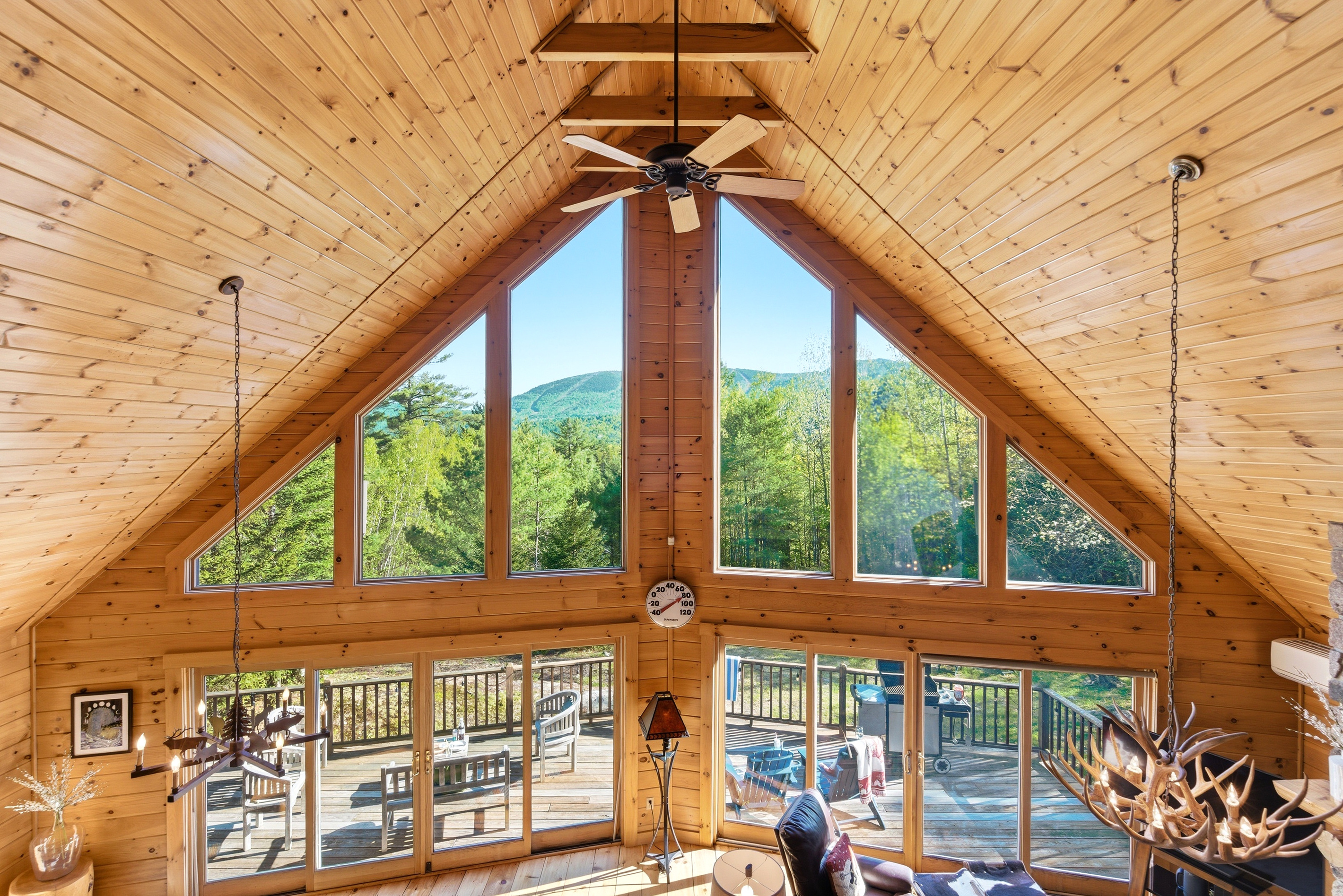 Floor-to-ceiling windows frame breathtaking mountain views and fill the cabin with natural light.