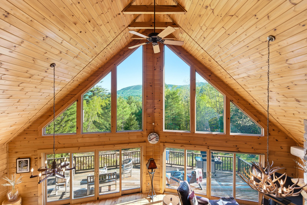 Floor-to-ceiling windows frame breathtaking mountain views and fill the cabin with natural light.