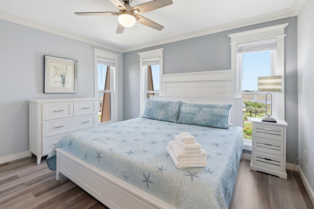 Coastal-inspired king suite with peaceful natural light