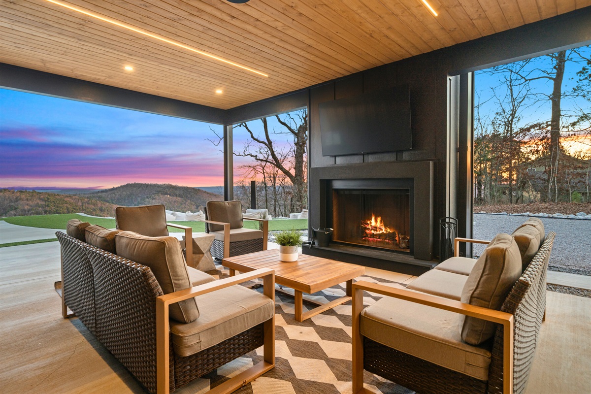 A cozy evening view of the outdoor lounge space where you can unwind, enjoy the atmosphere, and keep the conversation going long after sunset.