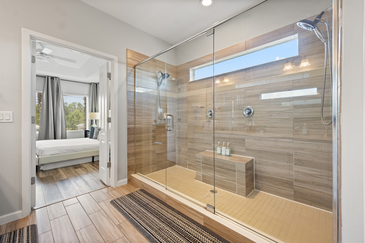The walk in shower with two shower heads is super spacious
