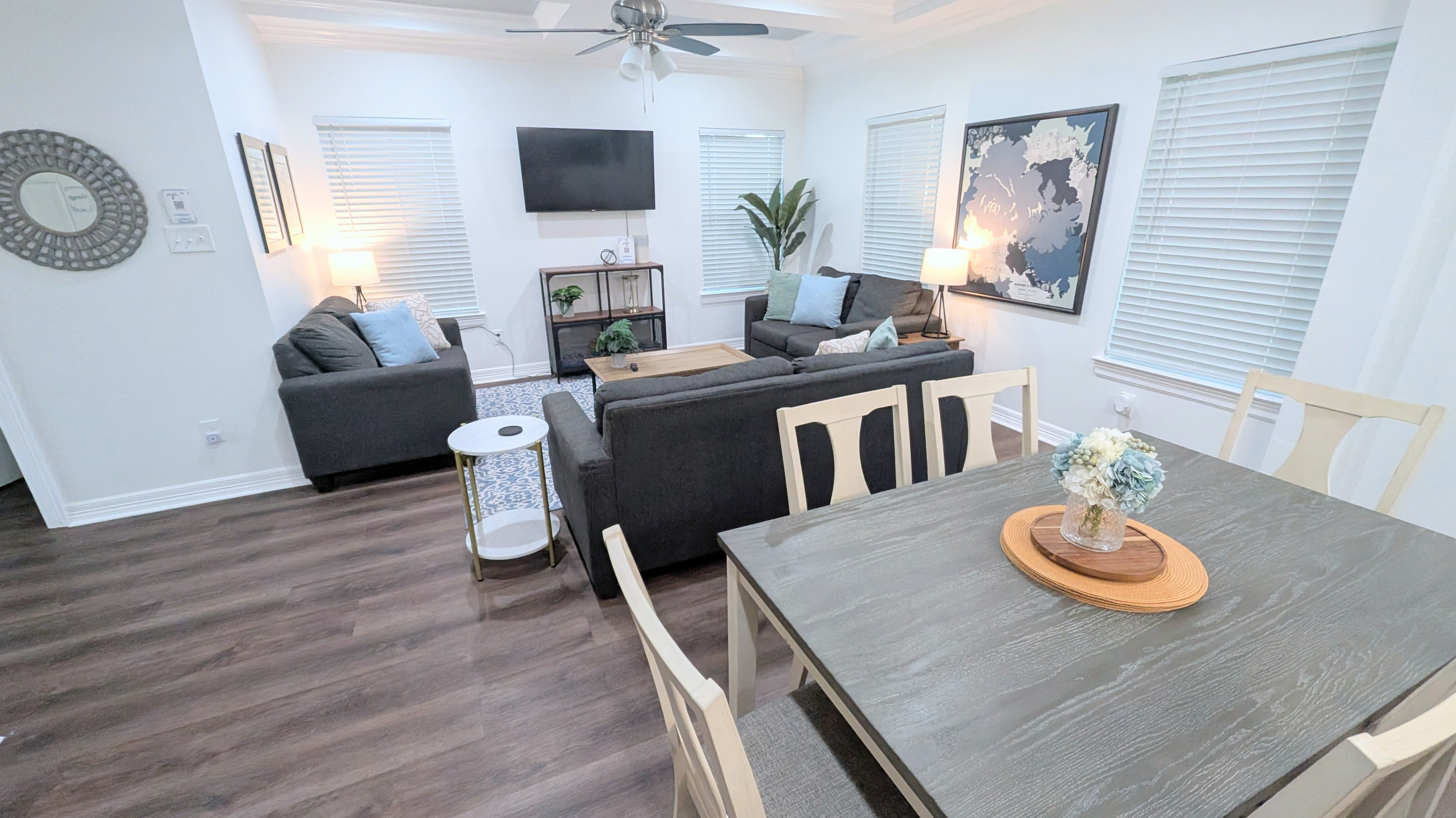 The dining area is directly behind the living room and offers additional spaces for your group to gather together. 