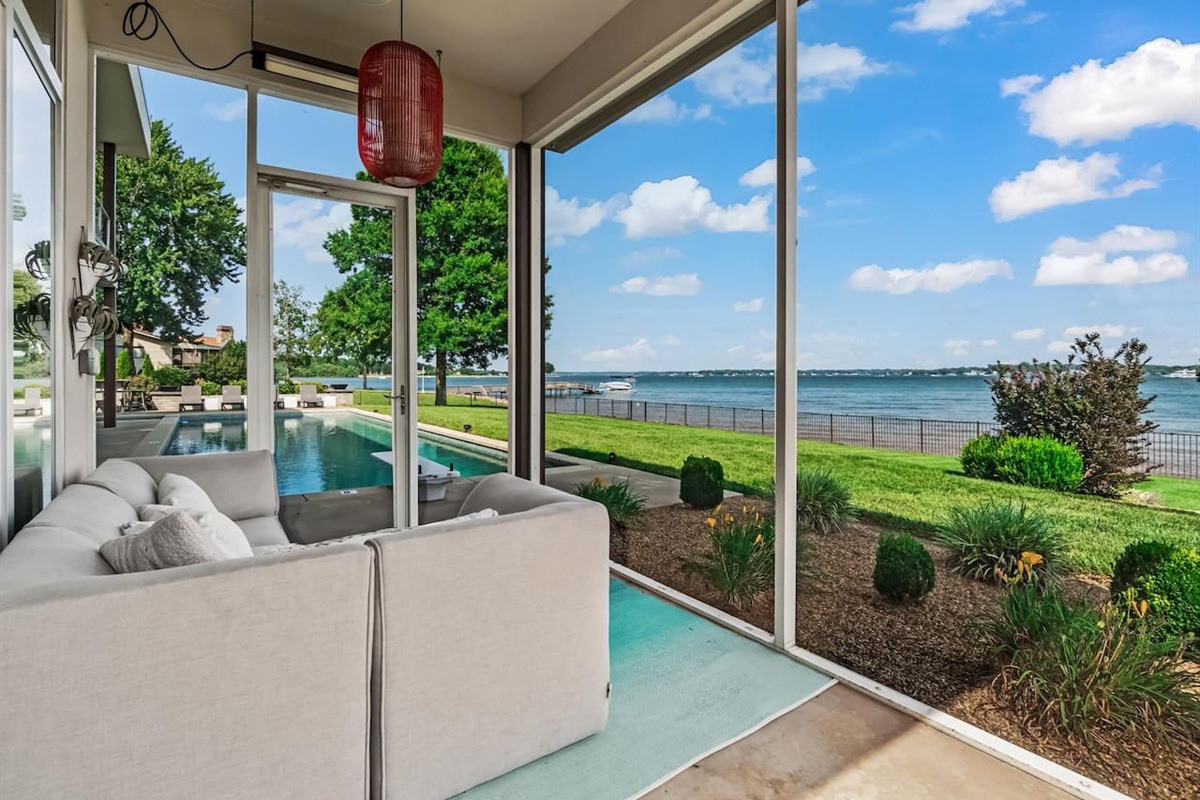 Screen porch outside master bedroom overlooking Lake Norman and pool area