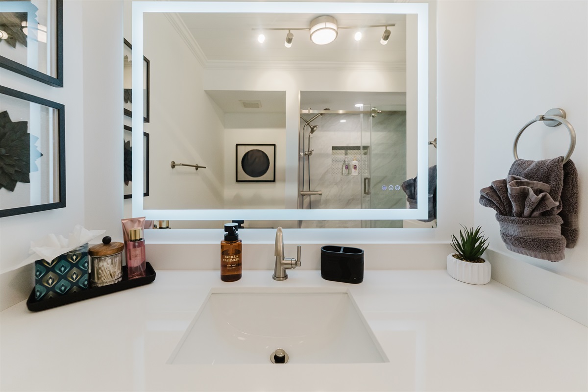 Clean, modern bathroom with fresh towels and essential amenities. Updated bathroom designed for comfort and convenience with a combination bath/shower. 
