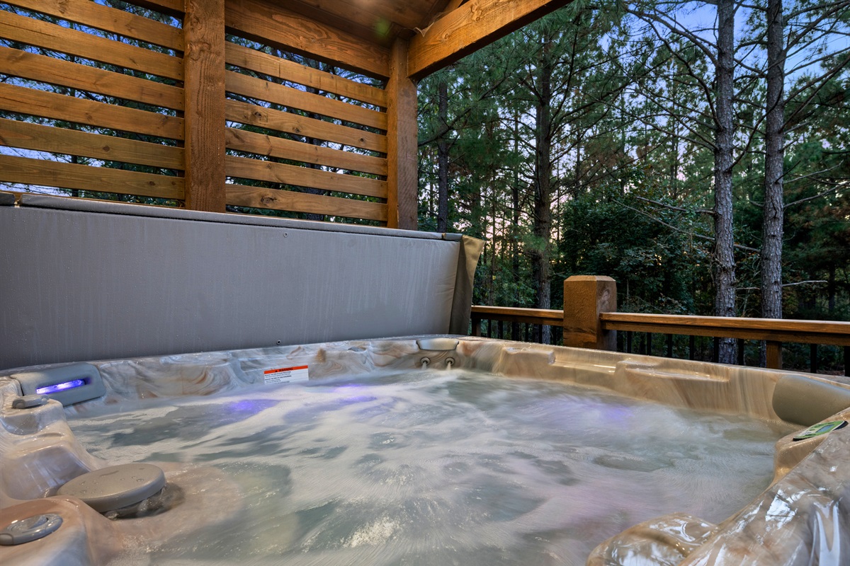 Soak your cares away in the bubbling hot tub surrounded by peaceful woods and the soothing sounds of nature.