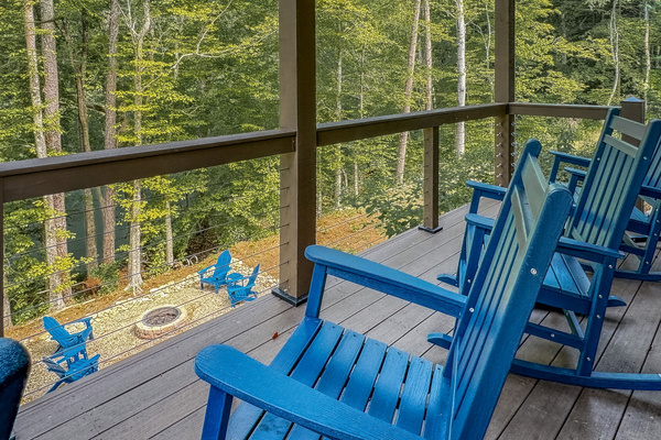 Lower level deck rocking chairs and fire pit view