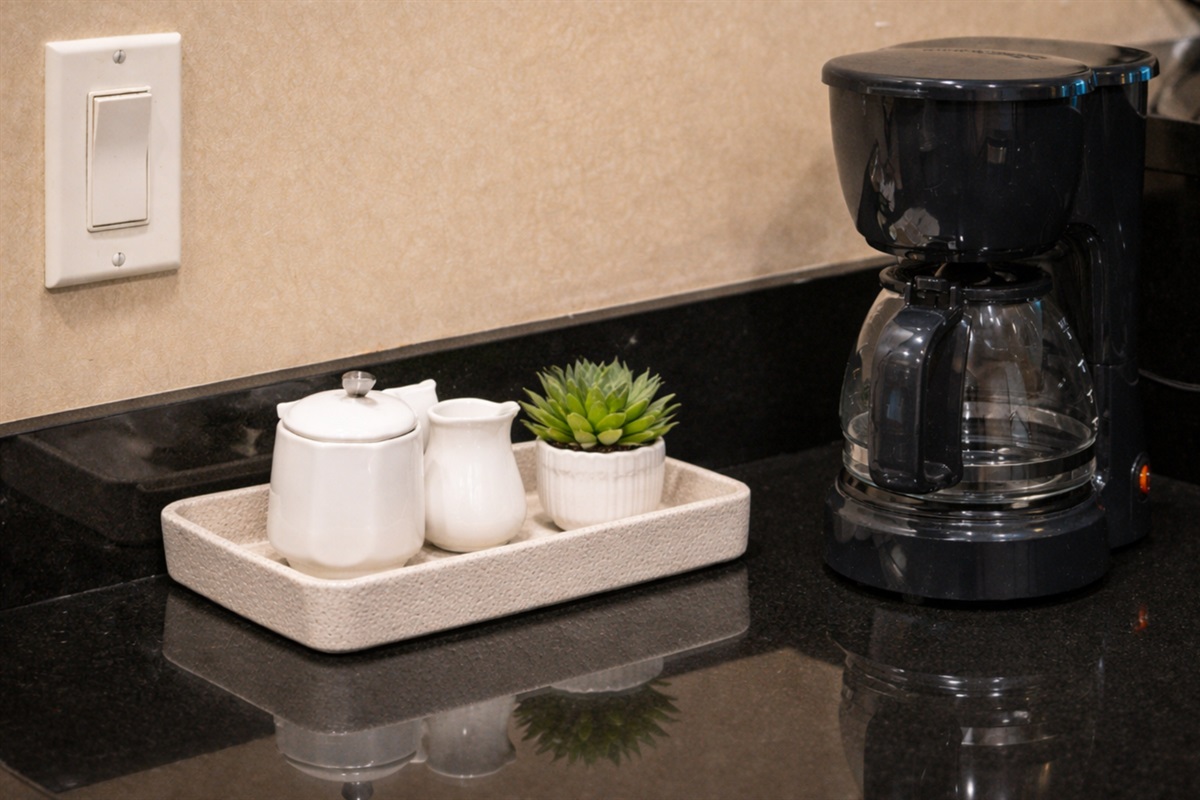 Gourmet Kitchen — Coffee Station with Drip Maker, Mugs, and Granite Countertop Surface