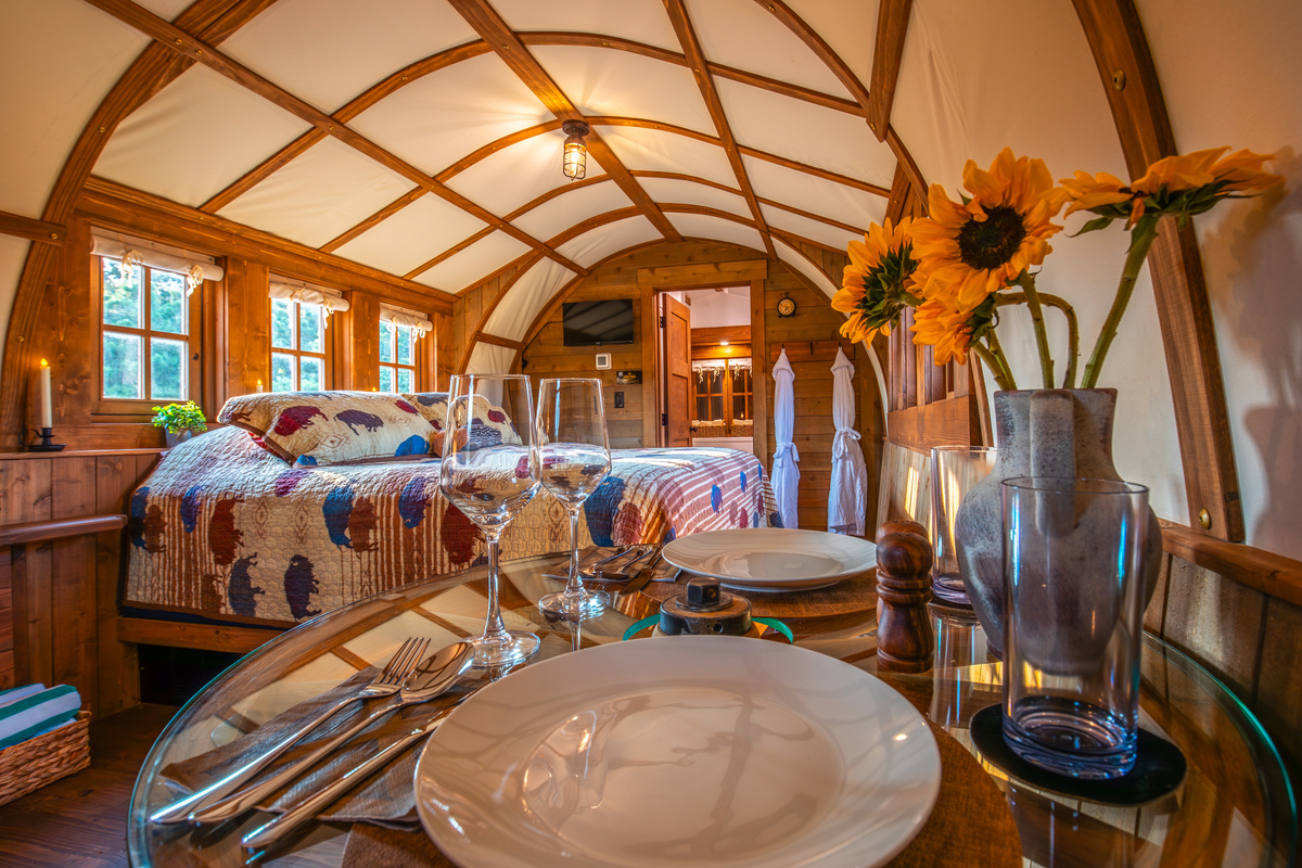 Romantic dining table for two inside the wagon, perfect for coffee, snacks, or a quiet night in.