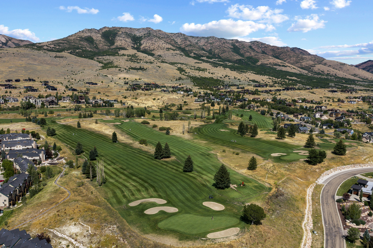 The surrounding landscape offers a beautiful mix of mountain terrain and manicured green space.