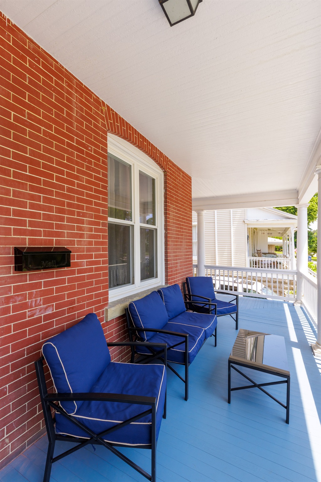 Large Wrap around porch with privacy around the corner if a guest is to stay in the other unit.