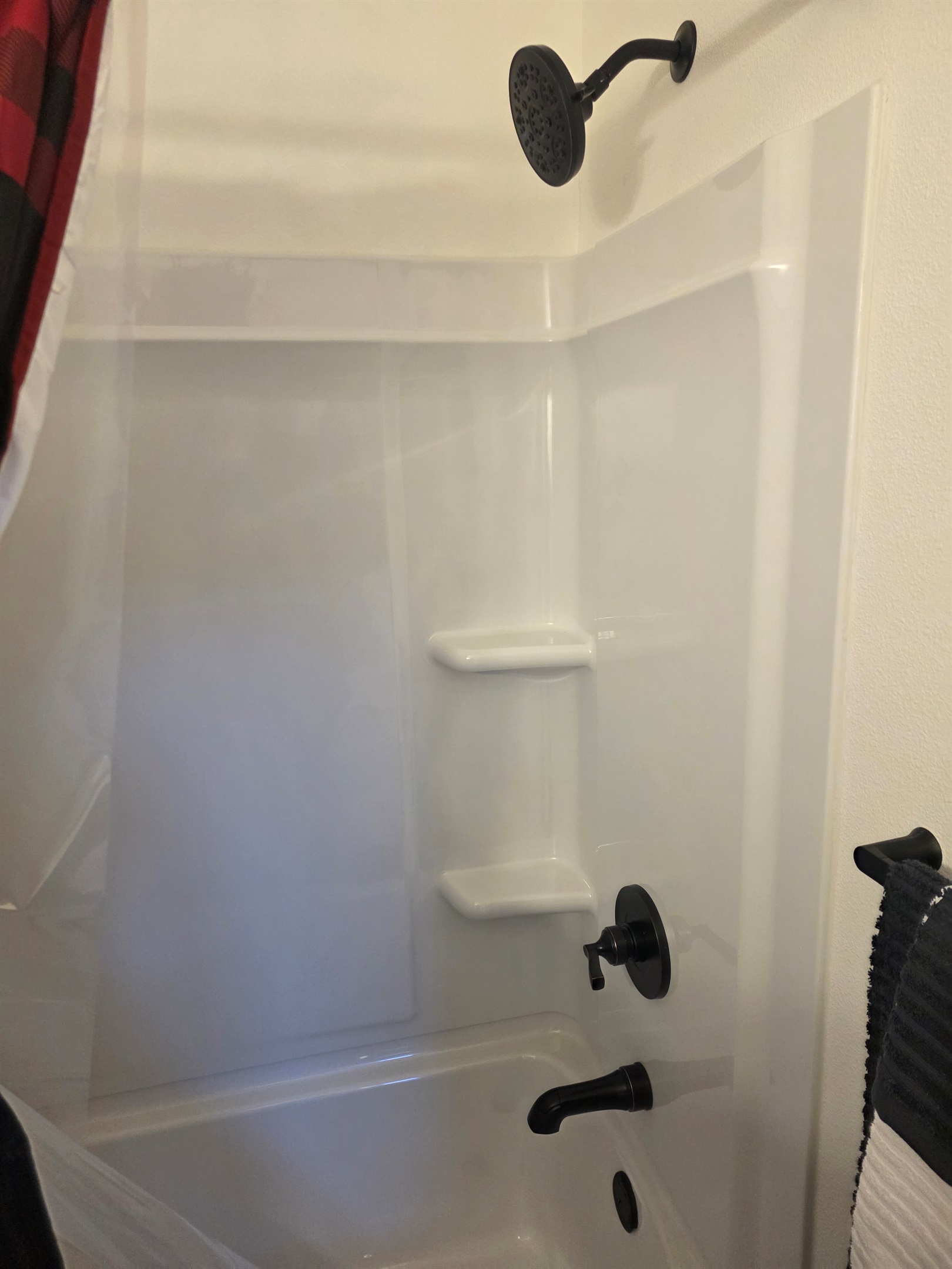 Bathroom includes a vanity, toilet, and shower/tub combo.