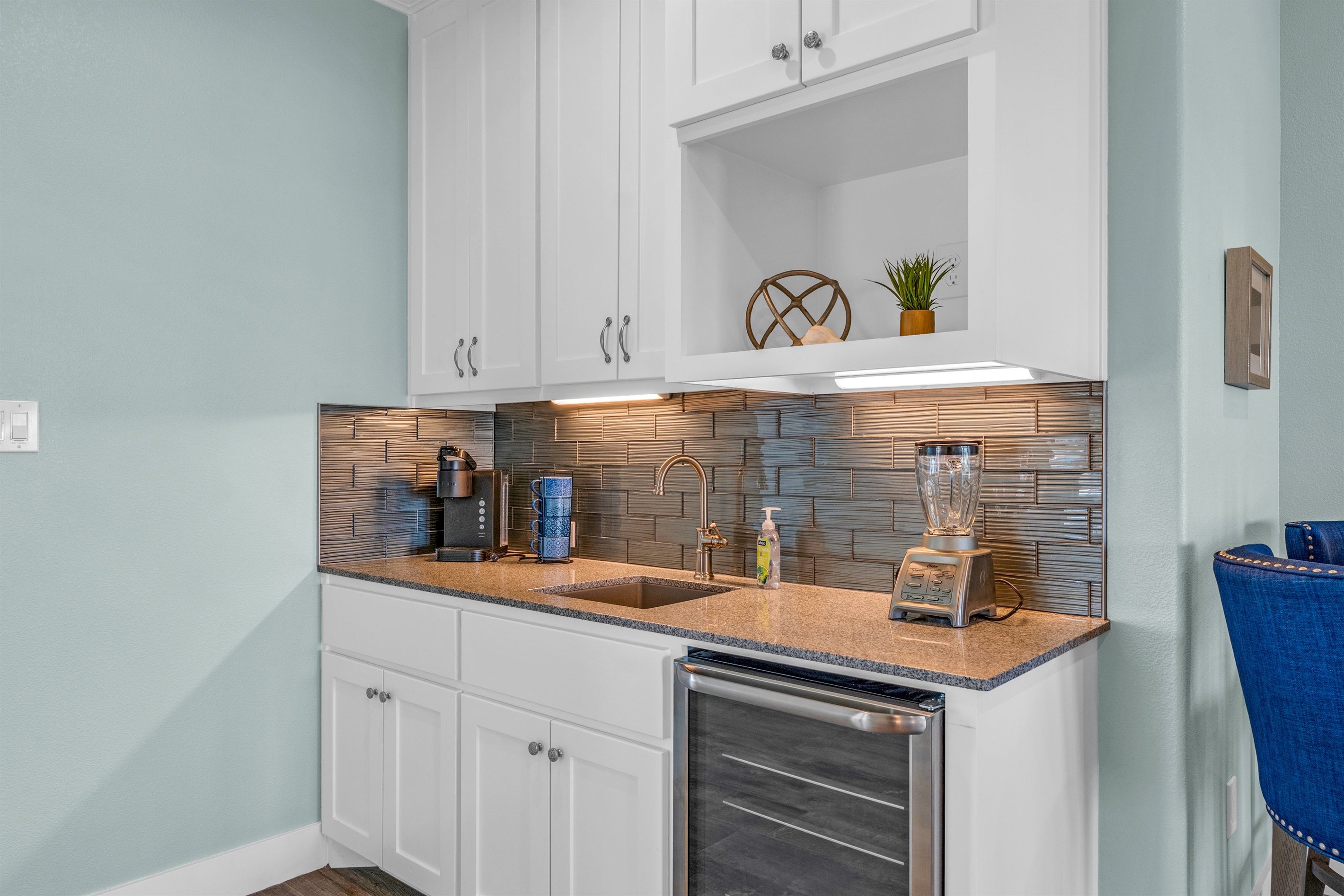 Crystal Paradise Media Room: Stay refreshed with a fully equipped wet bar featuring a coffee maker.