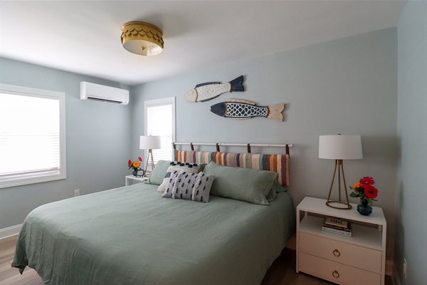 The main bedroom features a luxurious king size Nectar mattress, a Samsung Frame TV, a sound machine, a full length mirror, and a closet