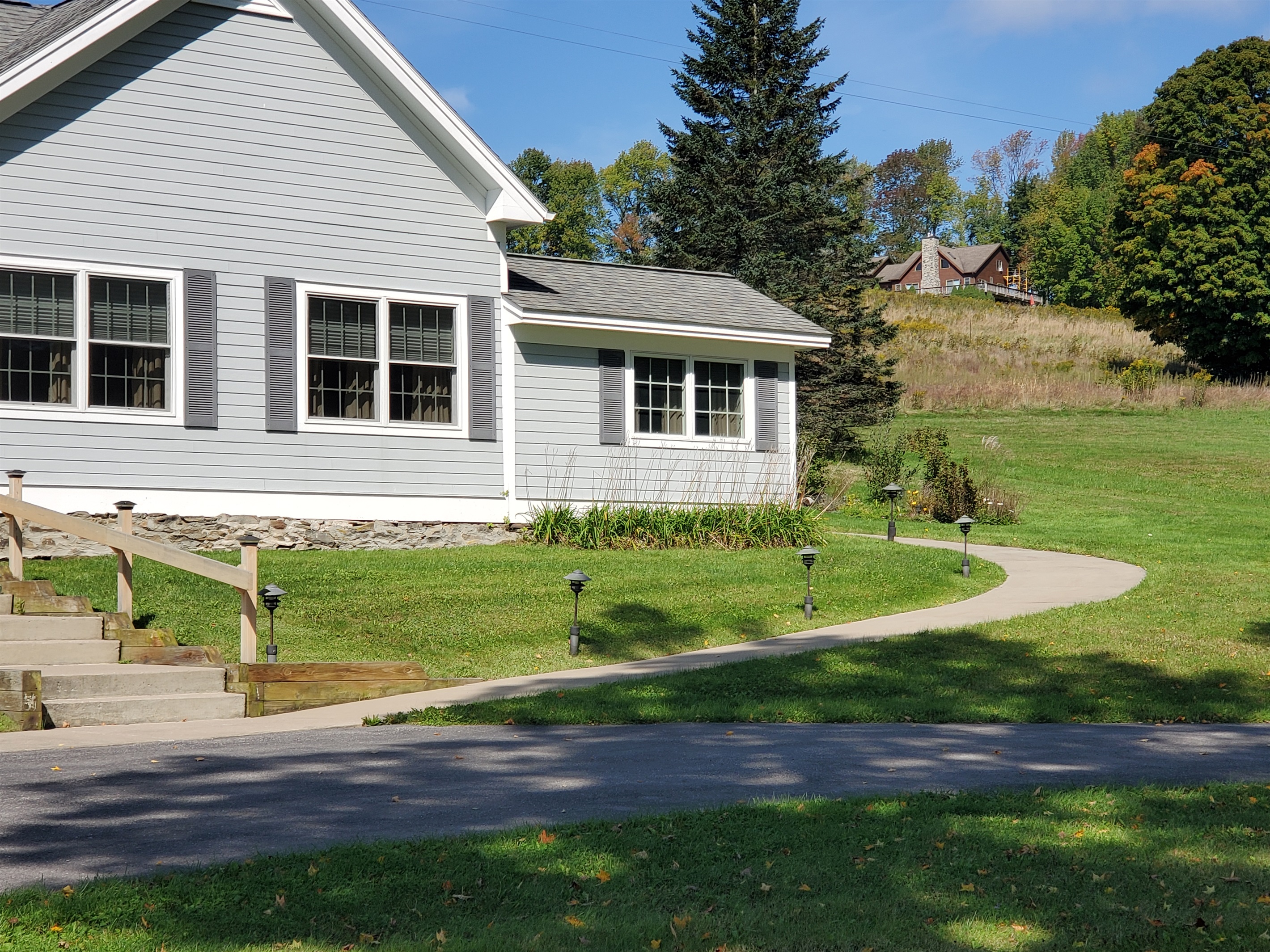 Pathway to patio around back. Note neighbor rental property in the background, Bavarian Farm.