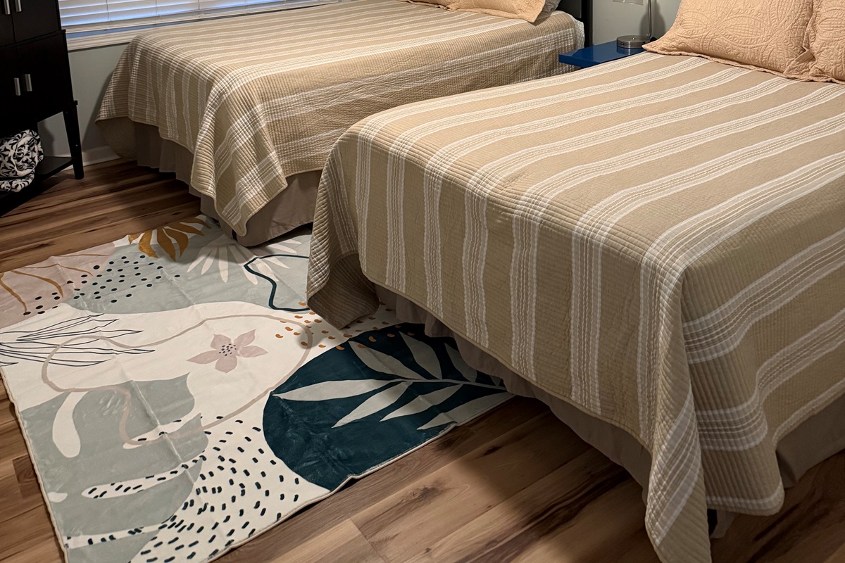 Walkout level bedroom features queen and full bed.