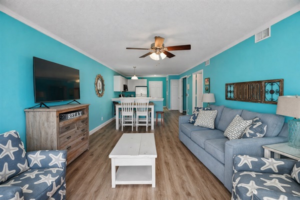 Large living room with sleeper sofa, smart TV, dining area and a convenient ground floor patio.
