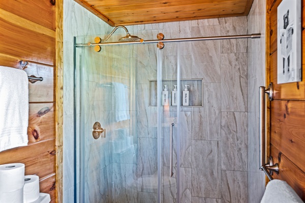 Enjoy added comfort and accessibility with a spacious walk-in shower featuring an adjustable shower head, from rain shower to standard jets.