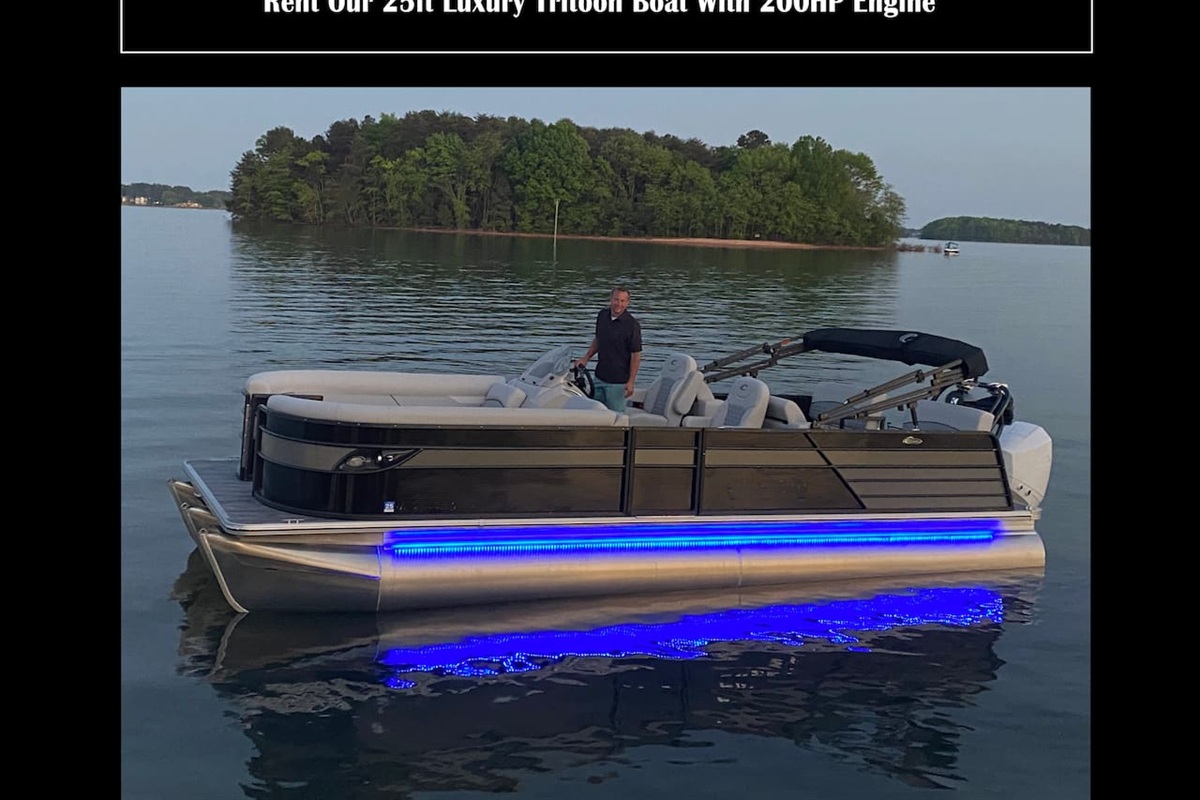 Our pontoon boat located at the dock available for guests to rent.