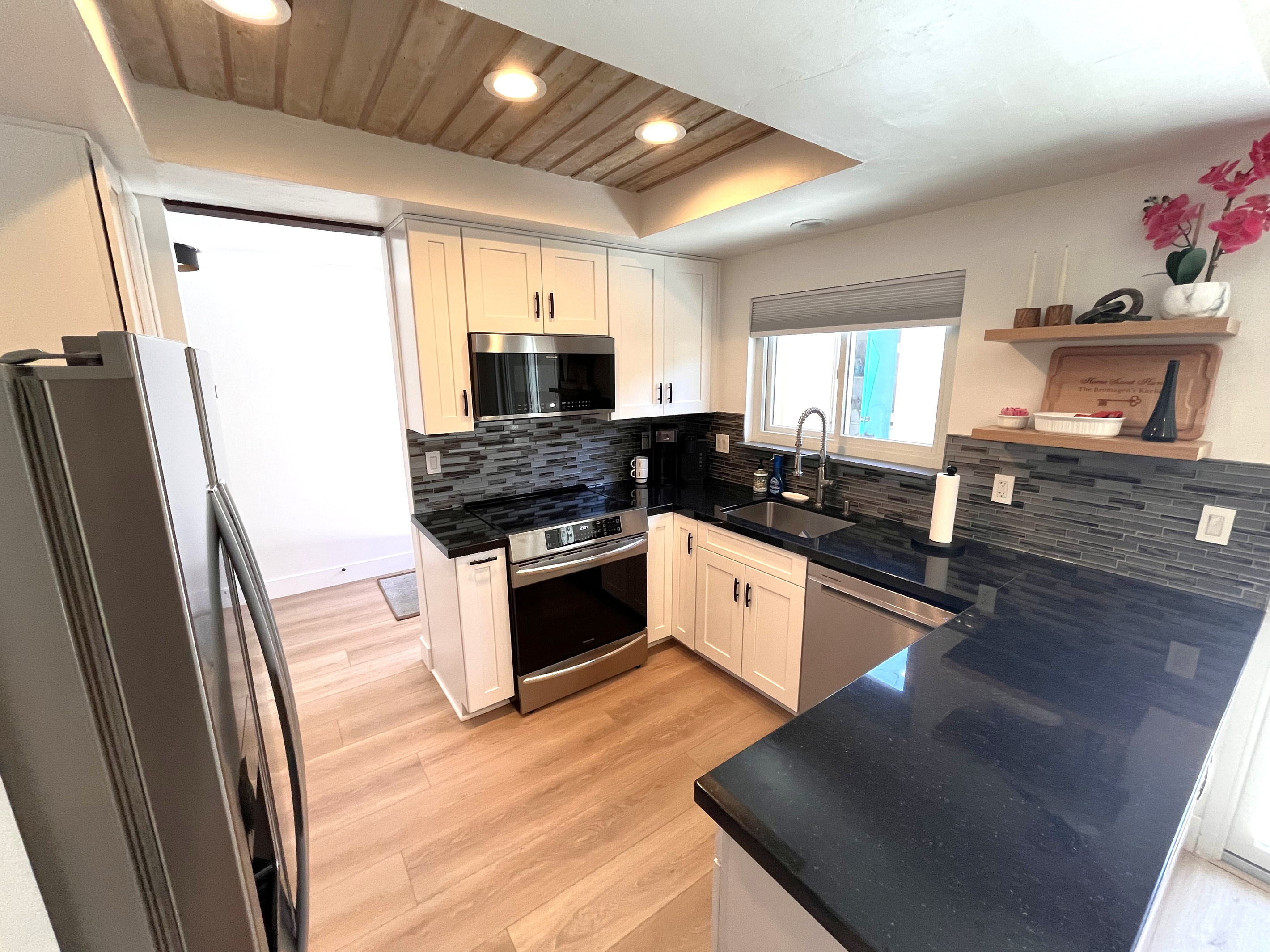 Induction stove top and convection oven, plus large pantry.