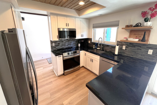 Induction stove top and convection oven, plus large pantry.