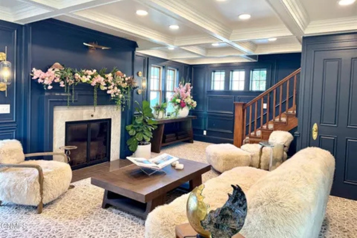 A warm, welcoming space where you can stretch out and enjoy the fireplace.