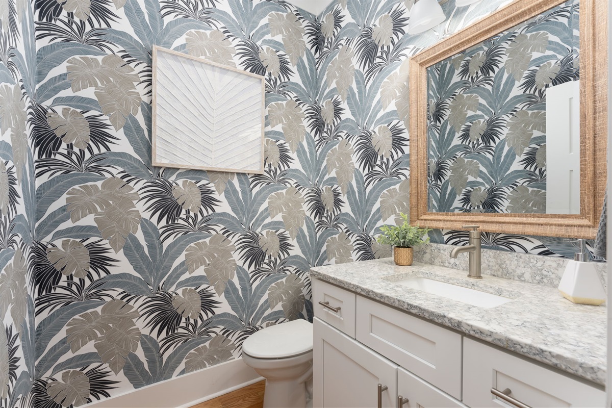 Private half bathroom off of the kitchen, near laundry room