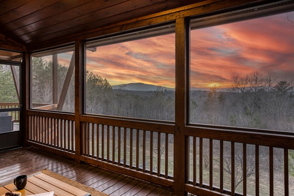 Mountain views from the wrap-around porch, especially the screened in porch in the back with comfy cozy outdoor furniture. 