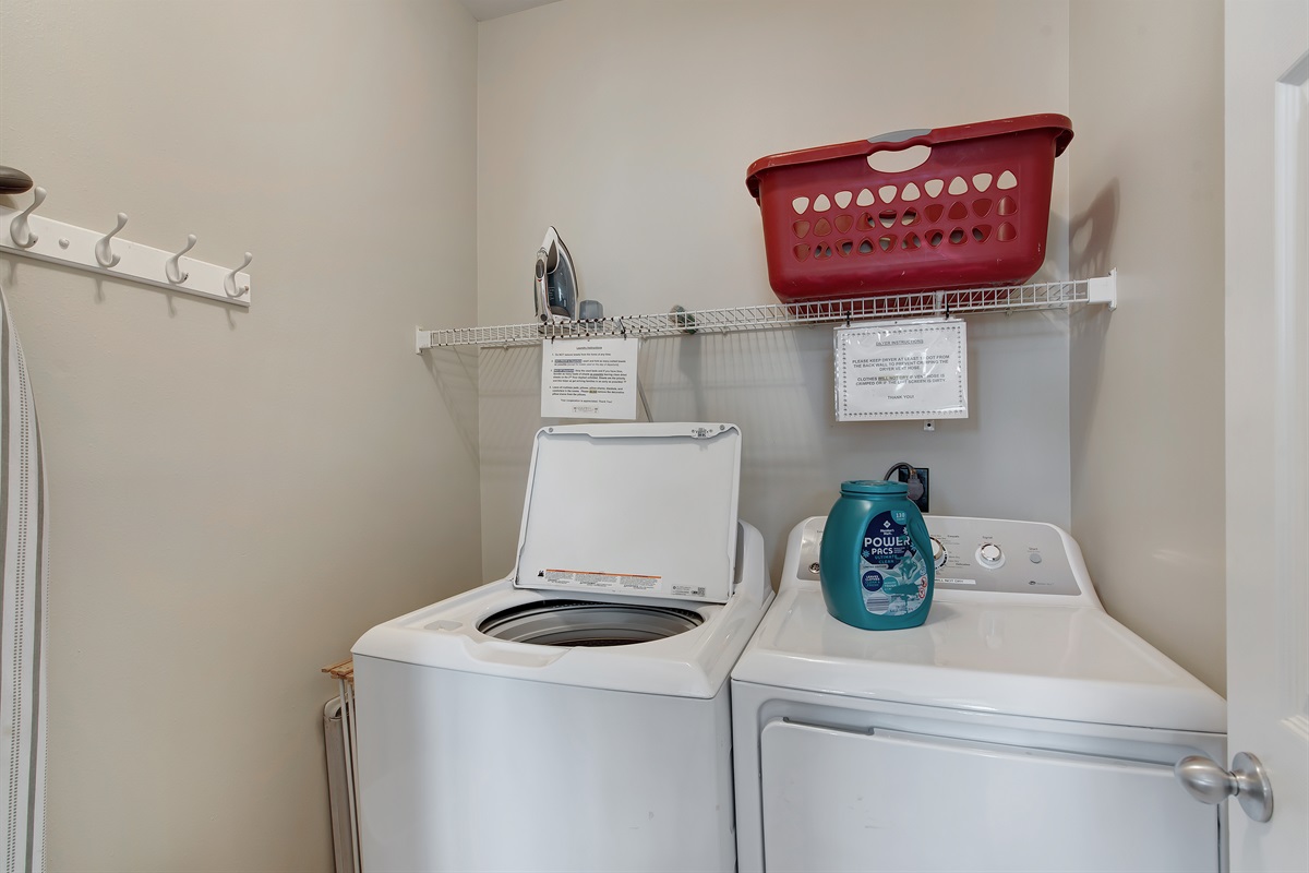 Laundry area with full‑size washer and dryer