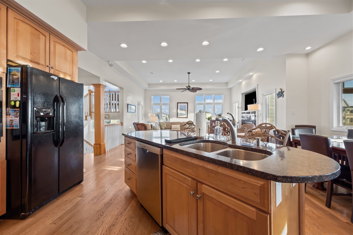 Spacious kitchen island with double sink&mdash;perfect for meal prep while staying connected with the group