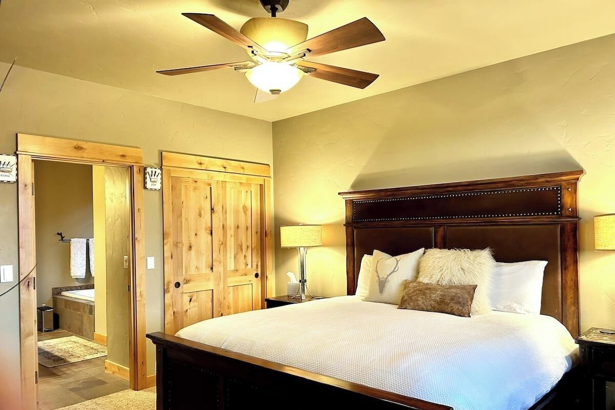 Main bedroom with south-facing windows and separate back patio entry