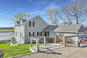 Backside of the property with stairs on the left side