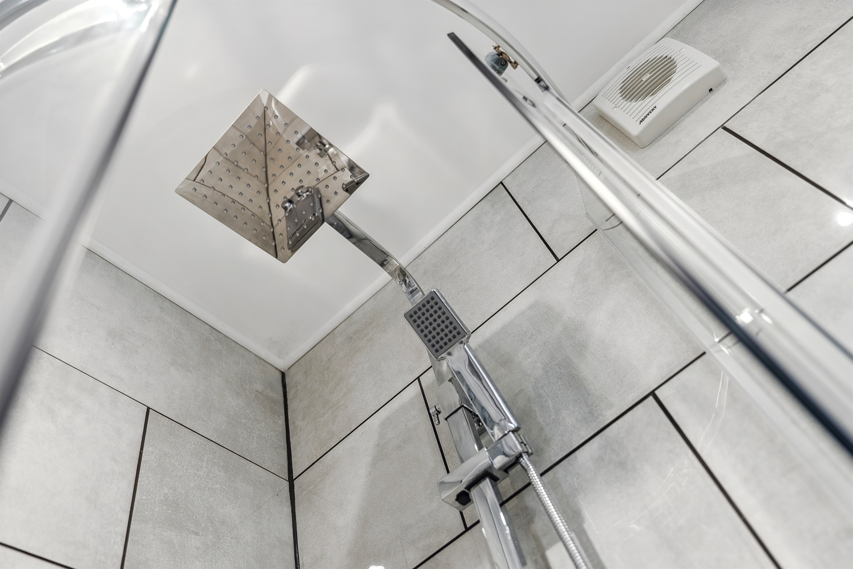 Drench style or conventional shower option with complimentary shower gel and hair conditioner dispensers.