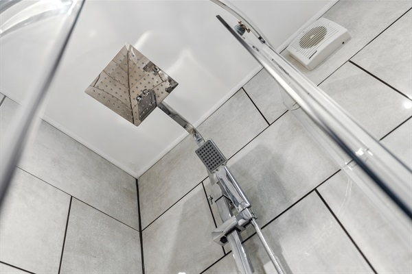 Drench style or conventional shower option with complimentary shower gel and hair conditioner dispensers.