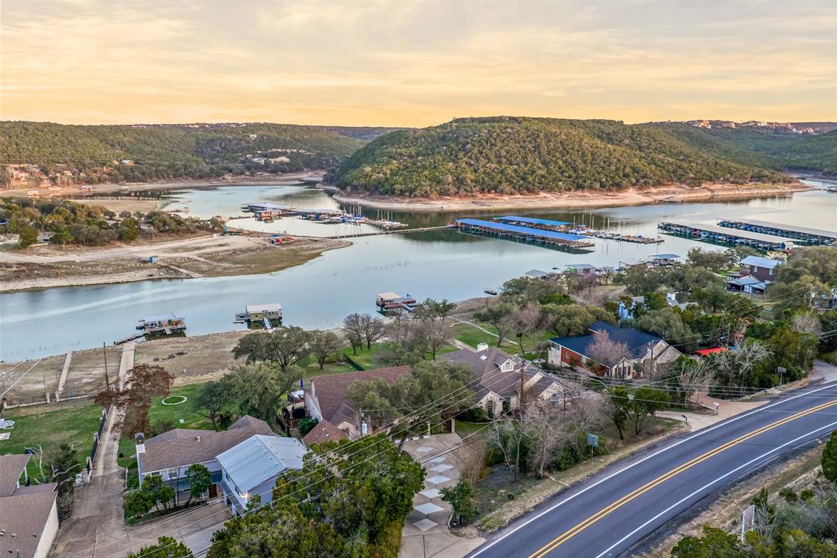 Wide aerial of the lake and nearby shoreline — prime waterfront setting.